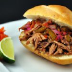 Savoring the Bold Flavors of Carnitas Torta Delights