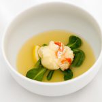 Savor Elegance: Lobster Consommé with Chive Dumplings