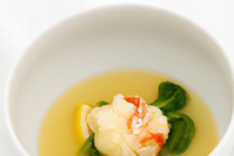 Savor Elegance: Lobster Consommé with Chive Dumplings